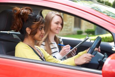 female driving instructor scaled 2 e1751921340276